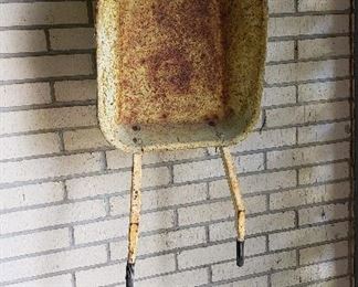 child size metal rusty wheel barrow