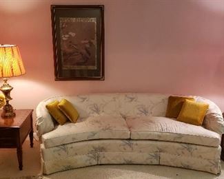 end tables, floral sofa, lamps, art