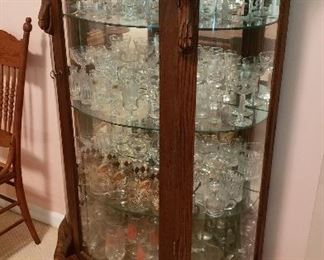 curio full of crystal stemware