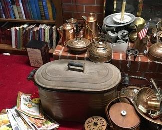 Antique copper boiler, copper tea pots, copper bakeware, copper coffee pots, and more copper. As well as vintage hardback books and magazines.