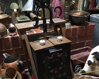 Vintage butter churn with folk art painted front.