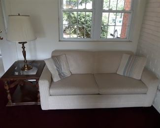 White Sofa, Wood and Glass End Table, Bras Table Lamp