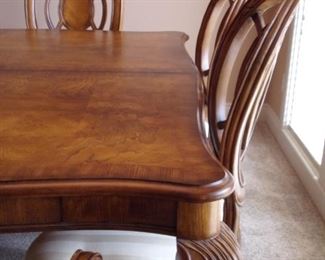Benchmark dining room table with 2 leaves and 6 chairs. Matching china cabinet.