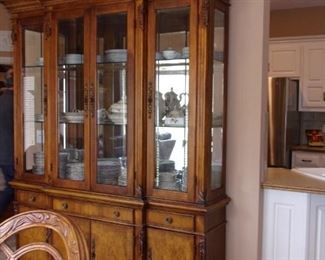 Benchmark lighted china cabinet. Matching dining room table and chairs.
