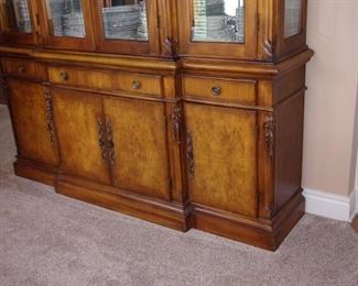 Benchmark lighted china cabinet. Matching dining room table and chairs.