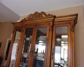 Benchmark lighted china cabinet. Matching dining room table and chairs.