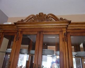 Benchmark lighted china cabinet. Matching dining room table and chairs.