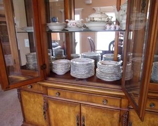 Benchmark lighted china cabinet. Matching dining room table and chairs.