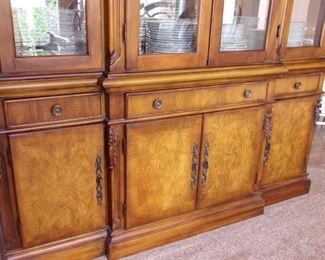 Benchmark lighted china cabinet. Matching dining room table and chairs.