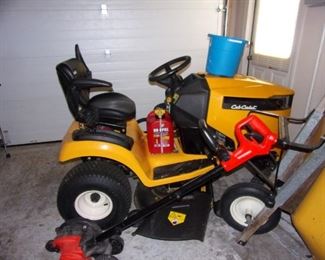 2017 Cub Cadet XT2 riding lawn tractor/mower- can purchase wagon to pull behind as well! Cub Cadet also added armrests. These can be added to XT1 models but is standard for XT2 tractors to give you a little added comfort. The XT2 models have larger engines so you have an increase in performance. ... Other models have a lever to push to engage the mower, but these tractors have a switch.