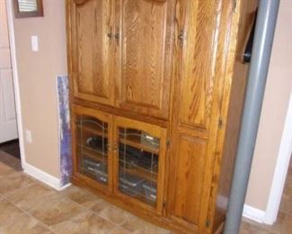 Oak entertainment center with tons of storage.