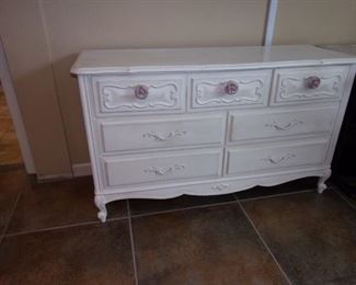 Antiqued white 7 drawer dresser with rose handles