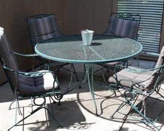 Wrought iron green patio table and four spring action chairs!