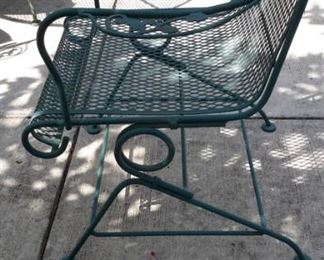 Wrought iron green patio table and four spring action chairs!