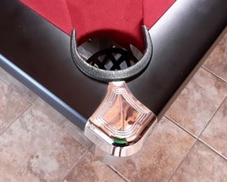 Contender by Brunswick in Graphite laminate/wood/metal with red felt includes pool table accessories such as cues.