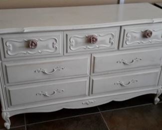 Antiqued white 7 drawer dresser with rose handles