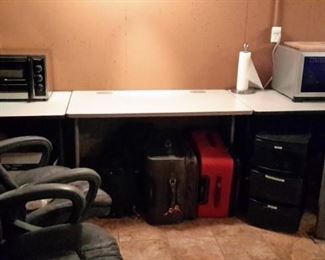 Three commercial grade desks; luggage, office chairs