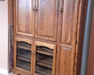 Oak entertainment center with tons of storage.