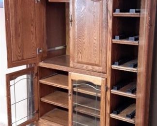 Oak entertainment center with tons of storage.
