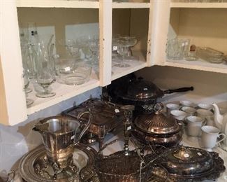 LOTS of silver plate serving pieces and glassware.