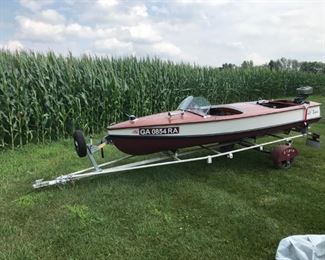 1952 Elgin wood boat, trailer, and outboard motor.