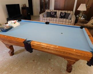 Game room classic billiard table, with all the accessories. Cues, cue rack, balls, ball rack, chalk etc.