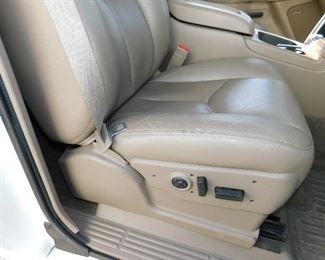 Slight cracking on the front passenger seat edge. Electric seats of course with lumbar support.
