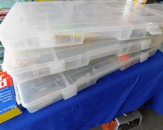 These plastic totes are full of jigs, lures and misc leaders.