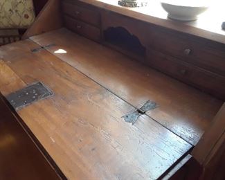 The hardware on this 18th century Italian desk is intact.