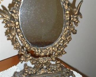 Ornate case iron dressing table mirror