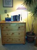 Pine Chest of drawers, books, lamp.
