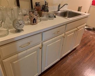 Laundry room cabinets with sink