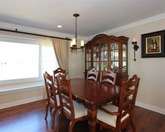 Dining room table (with extension leaves), 8 chairs, hutch, sideboard.