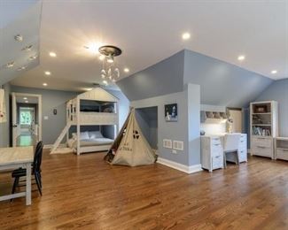 Play tent, play table, Desk with chair. Cabin bunk bed, artwork, decorative shelving.