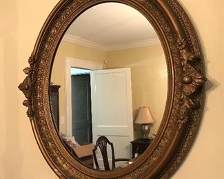 Gorgeous oval gilded mirror.  