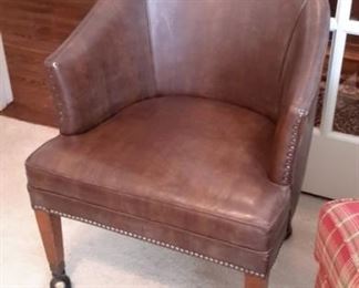 Nailhead trim accent chair on castors