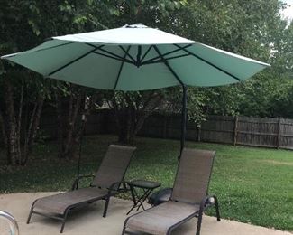 Very nice lounge chairs and huge patio umbrella