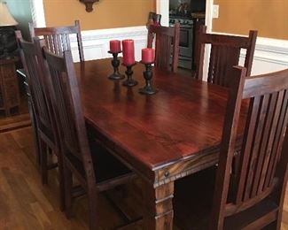 Look at the wood on this dining room table with 6 chairs