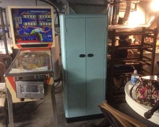Old pinball game. Needs TLC.  Repainted old metal cabinet