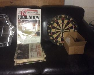 Nice dart board and sofa