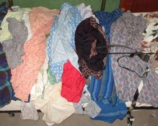 Pile of vintage ladies clothes from attic trunk