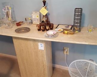 Marble table: Table base is 16" x 8" x 27". Top is 1" thick, beveled, and measures 16" and the widest and 54 " long.