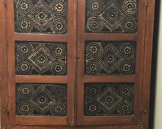 Punched tin doors of pie safe