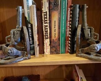 Revolver Bookends. Shoot up some books. But I am scurrred of guns. Please do not bring your gun. My security officer will shoot you dead and then I will have to clean it up. I do no not like body parts. Or Gin. I cannot stand Gin or Bananas.
