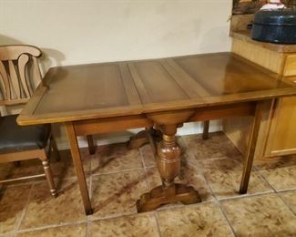 Folding Table....Antique. Much like me. Still got my legs, still standing, but I am old. Ol Lord, can somebody call 911