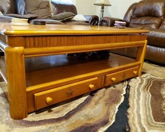Coffee Table. The top pulls up so that you can use it as a table while watching Wheel of Fortune or Antiques Roadshow