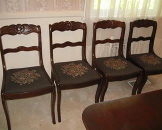 4 chairs upholstered in one fabric and...