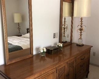 Dresser with double mirrors and large brass and glass mid-century lamp