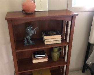 wood bookcase and objects of art