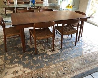 Teak dining table - mid-century with 12 chairs (10 side and 2 arm) - by Povl Dinesen, and large wool area rug